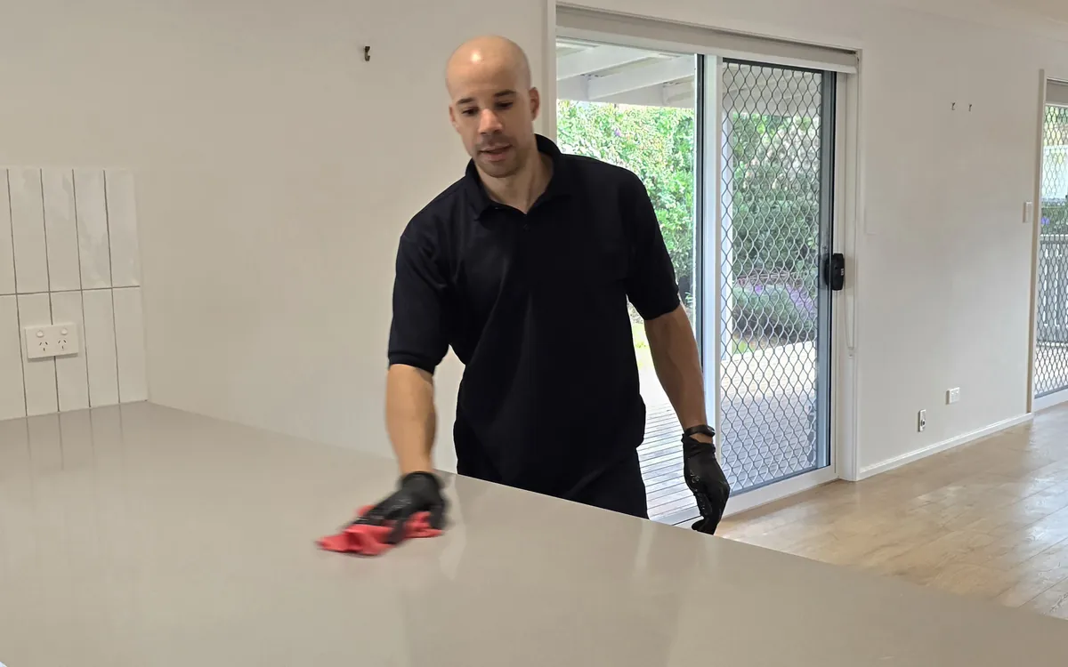 Clean Protocol cleaning a kitchen benchtop in an empty rental at handover, Illawarra